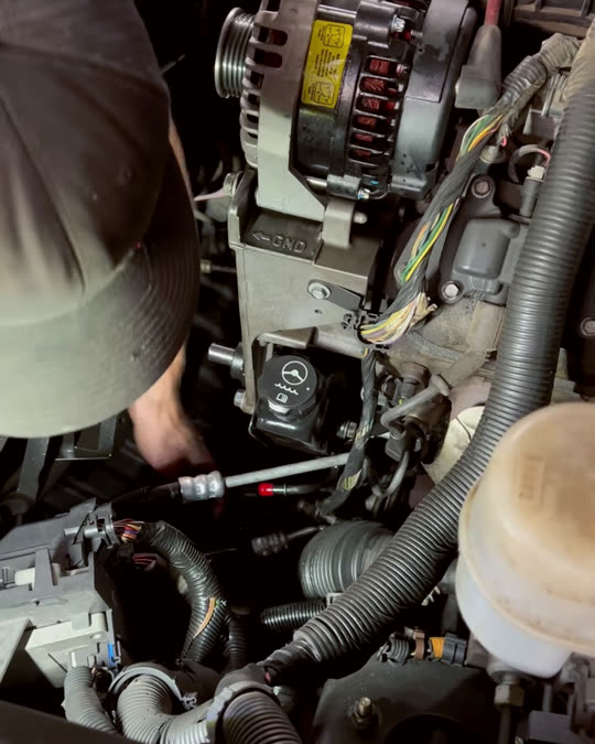 Hands at work on an engine