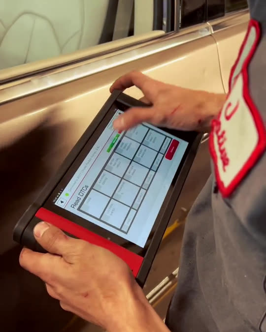Technician reading a scan tool